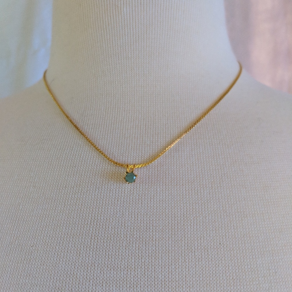 Gold and Jade stone necklace.